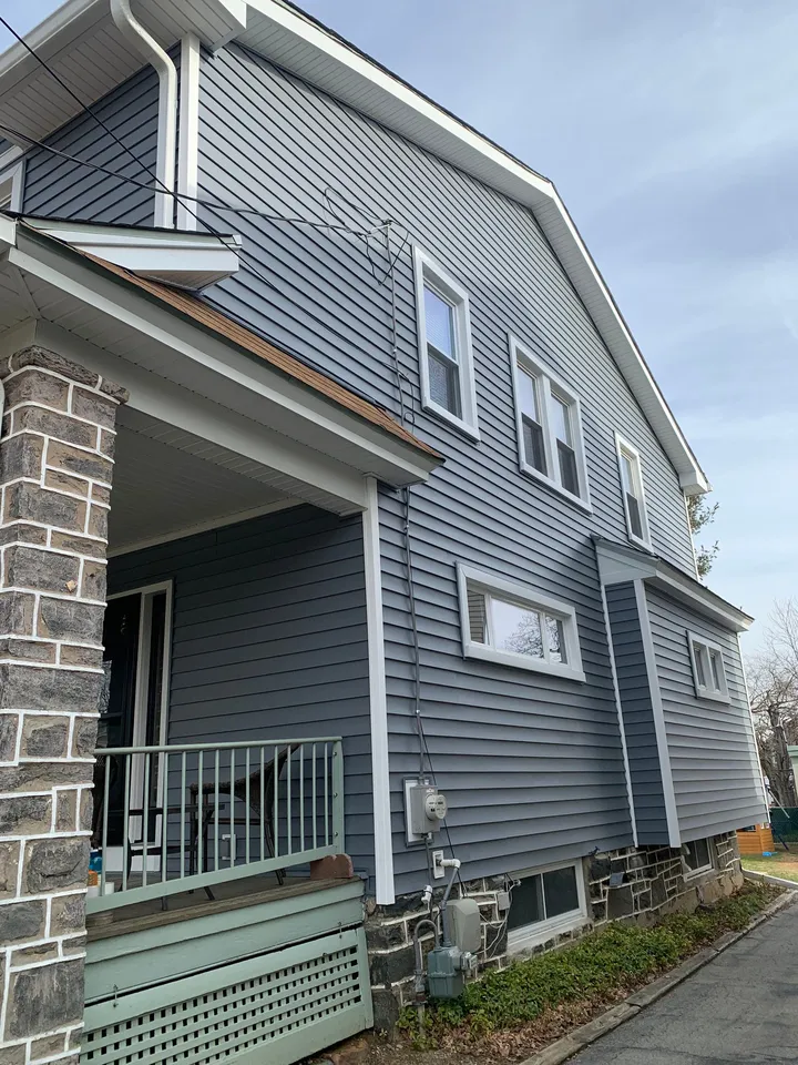 New gray vinyl siding on a home