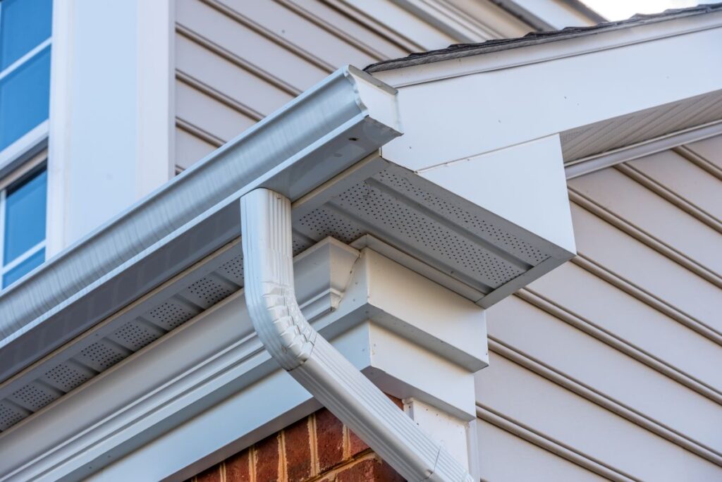 eaves on a house close up white gutter system 
