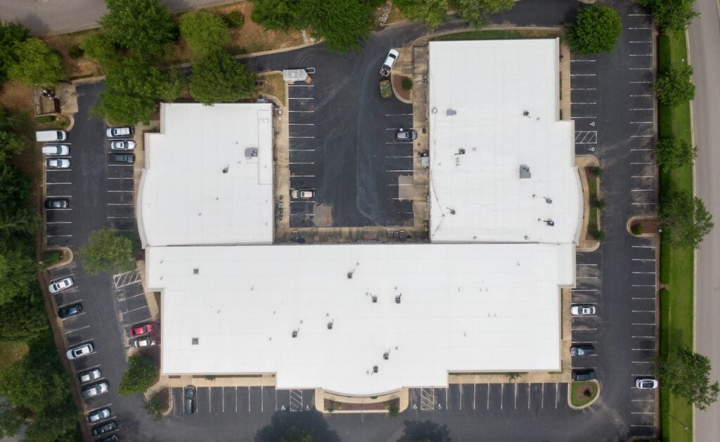 aerial view of white tpo roofing commercial building