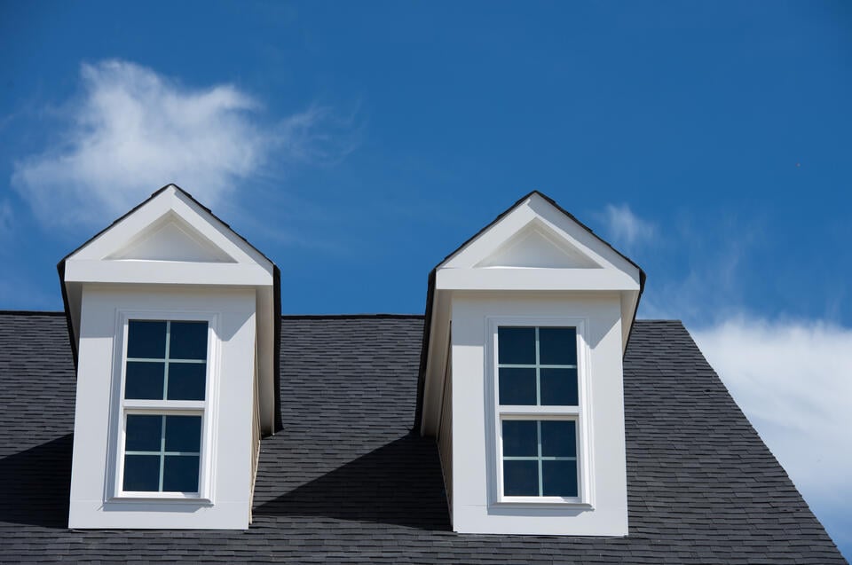 types of dormers-gray shingle roof with white dormers