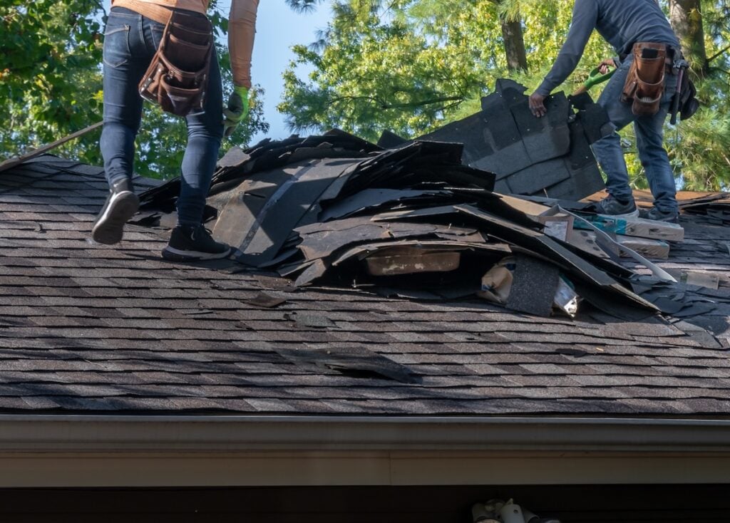 Removing storm damaged roofing