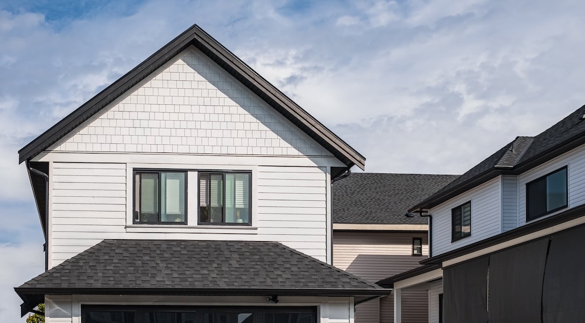 White house with black shingle roof