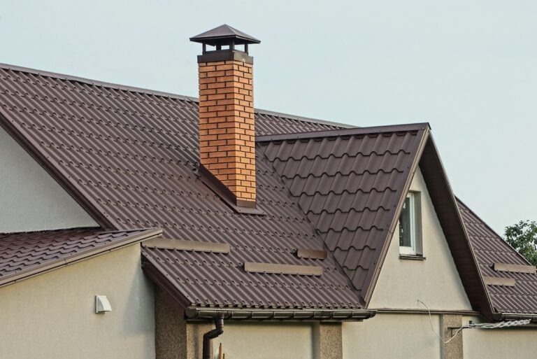 red brick chimney with rain cap
