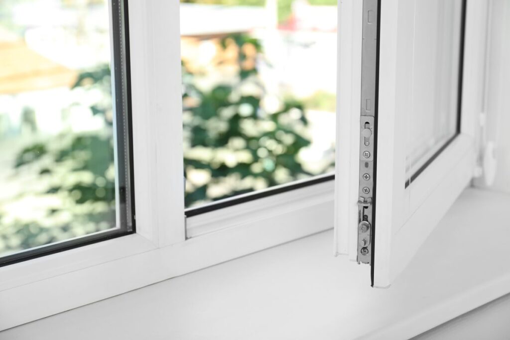 an open white window and an empty white windowsill