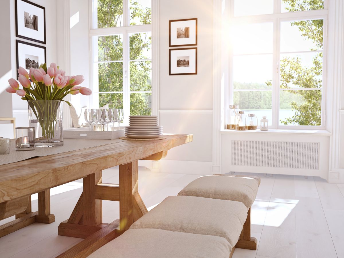 bright dining room with large windows and a lot of natural light